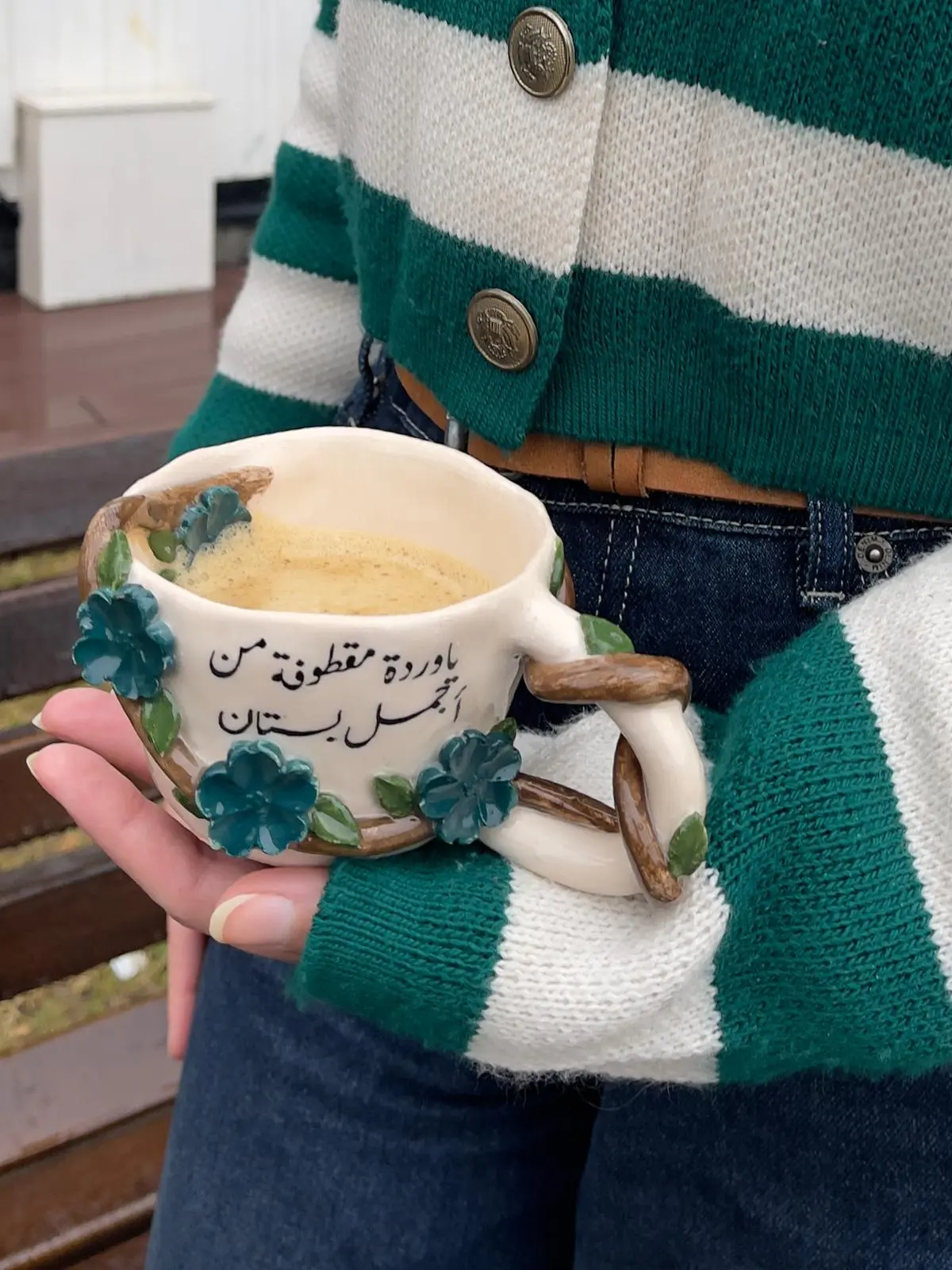 Duha Khaled shaping a ceramic mug on a pottery wheel in her Mersin studio